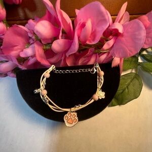 Women’s kitten, cat paw bracelet silver plated, cream color strands.